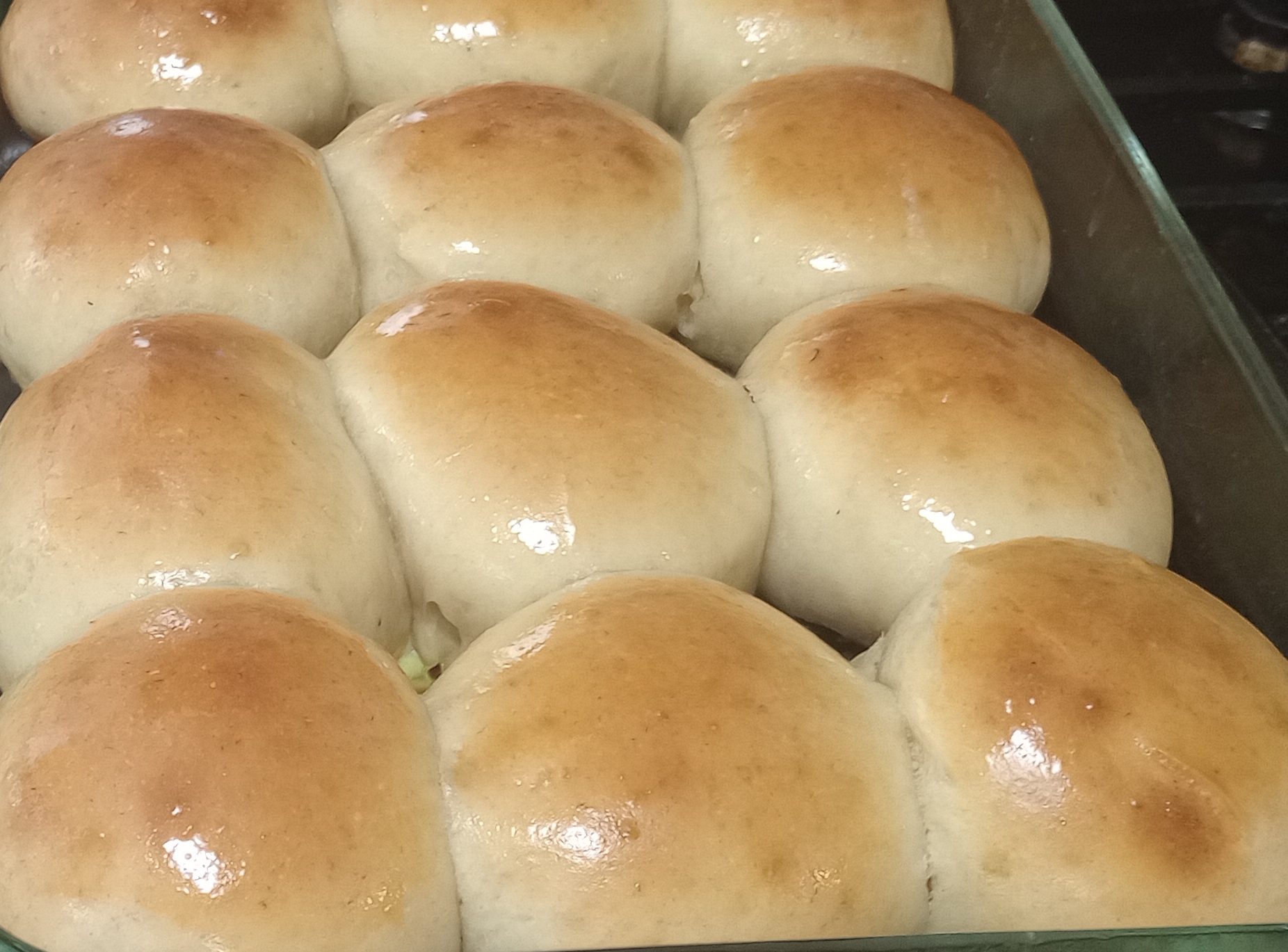 shiny fresh hawaiian rolls brushed with fresh butter.